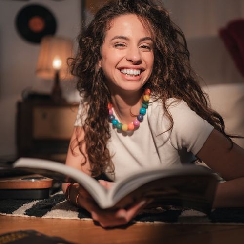 Portrait of yoga expert Sofia Kravchuk smiling in studio