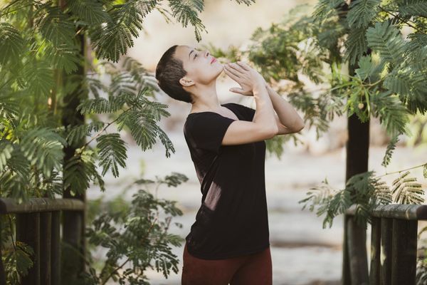 Serene woman in meditation focusing on deep breathing exercises